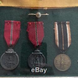 Framed Set Of Original WWII German Medals And Badges