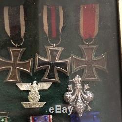 Framed Set Of Original WWII German Medals And Badges