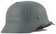 German WW2 M40 helmet with the bullet hole refurbished original