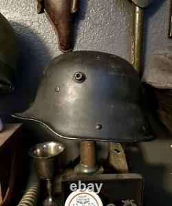 Original WW1 German to WW2 Transitional helmet. Named Finnish corporal