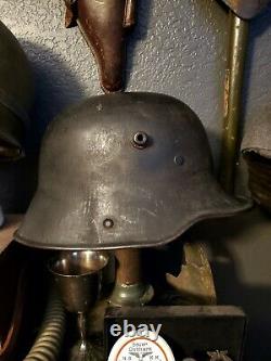 Original WW1 German to WW2 Transitional helmet. Named Finnish corporal