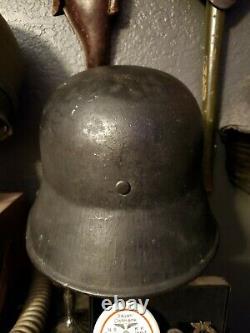 Original WW1 German to WW2 Transitional helmet. Named Finnish corporal