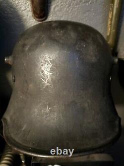 Original WW1 German to WW2 Transitional helmet. Named Finnish corporal