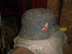 WW2 German helmet M 35 in native paint with a ring of Balaclava. Original