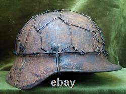 WW2. German original M 40 helmet with shrapnel damage. Wehrmacht. WWII. WWII2