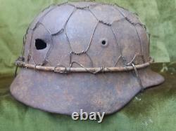 WW2. German original M 40 helmet with shrapnel damage. Wehrmacht. WWII. WWII2
