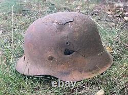 WW2 German original battledamaged helmet M42. CKL64