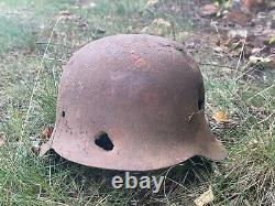 WW2 German original battledamaged helmet M42. CKL64