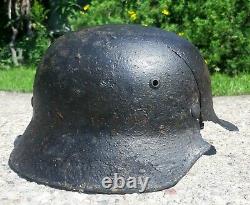 WW2 Original German helmet M35. Size 62. Battledamaged