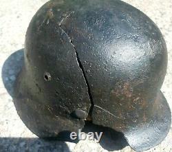 WW2 Original German helmet M35. Size 62. Battledamaged