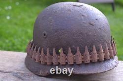 WW2 WWII Original German Helmet M35 (battle demages)from the battlefield. Kurland