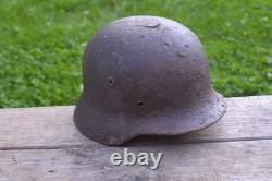 WW2 WWII Original German Helmet M35 (battle demages)from the battlefield. Kurland