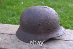WW2 WWII Original German Helmet M35 (battle demages)from the battlefield. Kurland