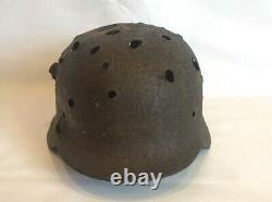 WW2 original German helmet M 40 with a lot of combat damage. Unique lot